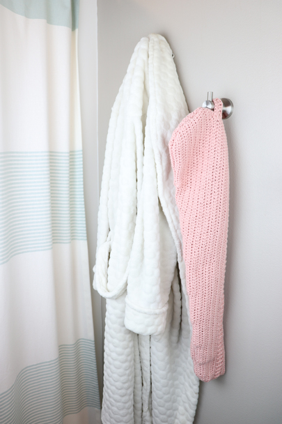 The Crochet Hair Towel hanging on its hook