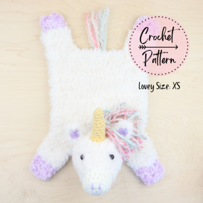 XS crochet unicorn lovey laying flat