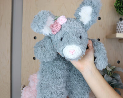 pink rosette on gray bunny