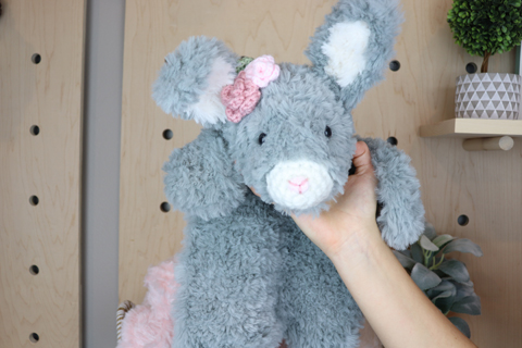pink rosette on gray bunny