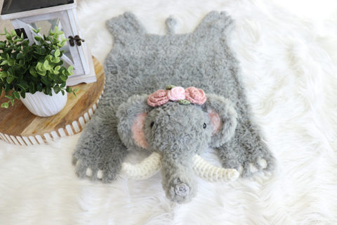 gray elephant with pink rose crown
