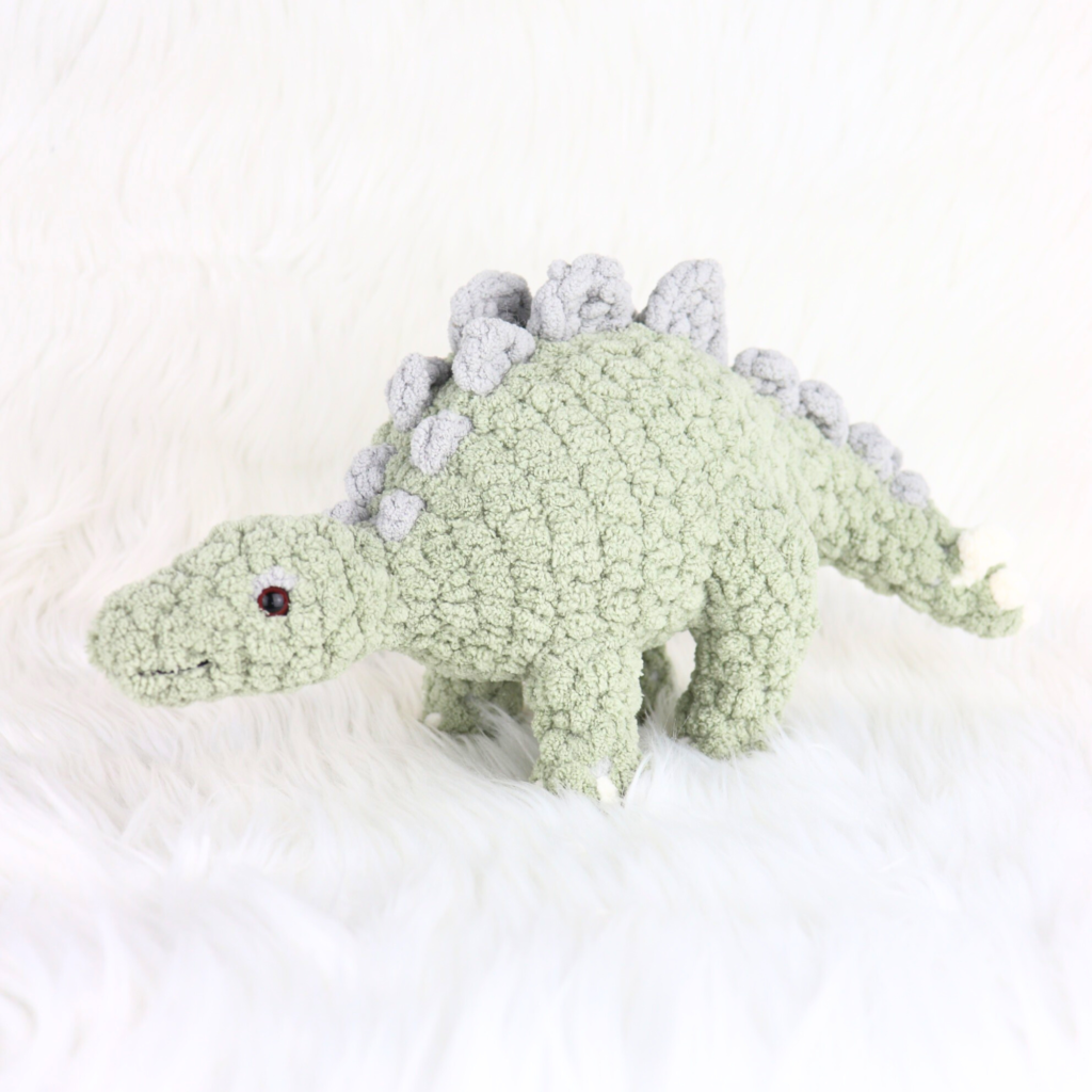 crochet stegosaurus on a desk