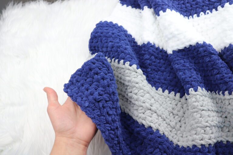 crochet blanket laying on a desk