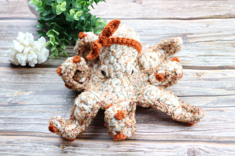crochet octopus laying on desk