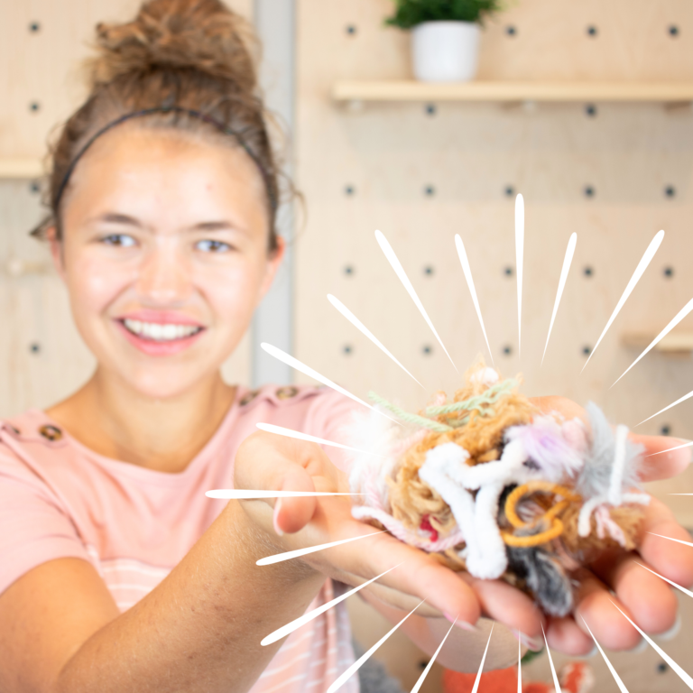 girl holding yarn scraps to use up