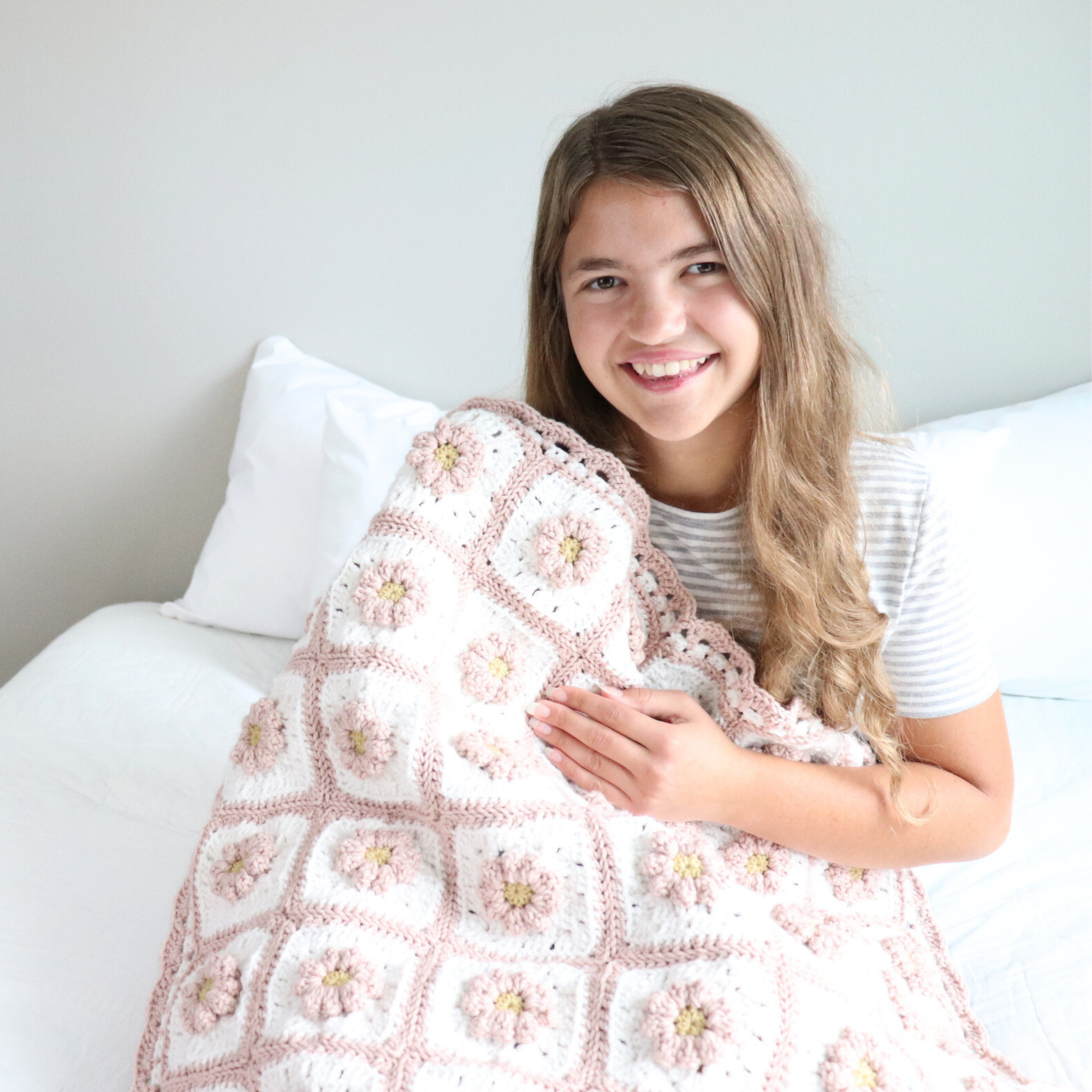 crochet wildflower blanket on girl